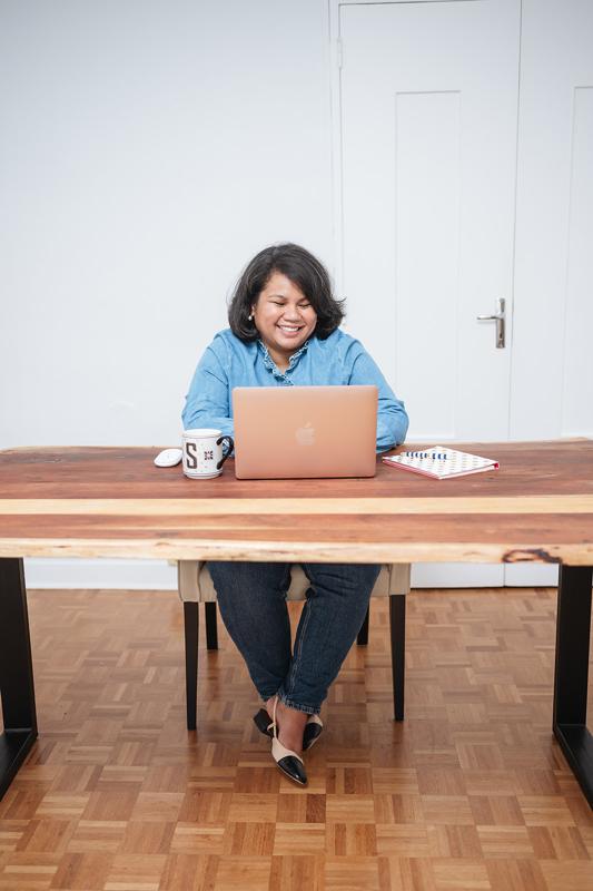 The Plannerist - Working woman with laptop sitting at desk
